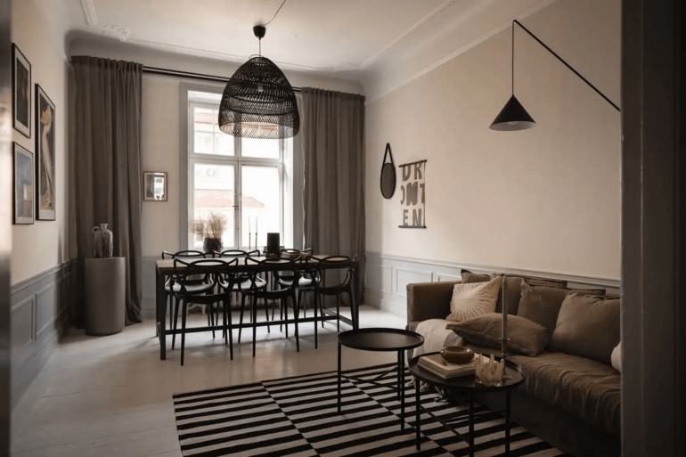 A historic apartment with a light grey kitchen and grey wainscoting1