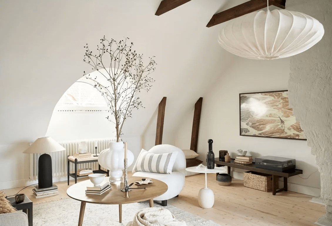 Stylish attic home with exposed beams and a dark wood kitchen15